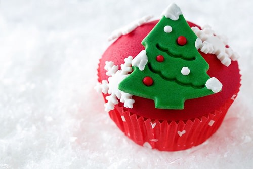 Christmas cake or cupcakes with a Christmas tree on top