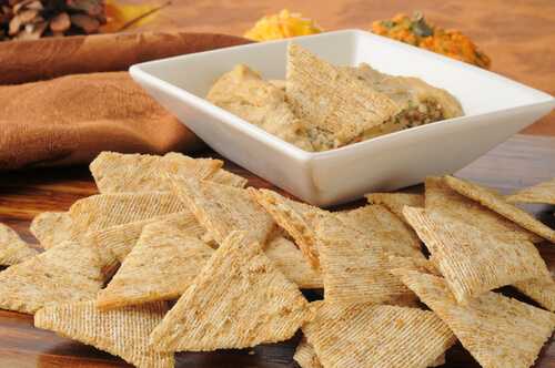 Whole-grain crackers with hummus