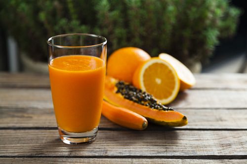 Healthy orange, papaya and carrot smoothie