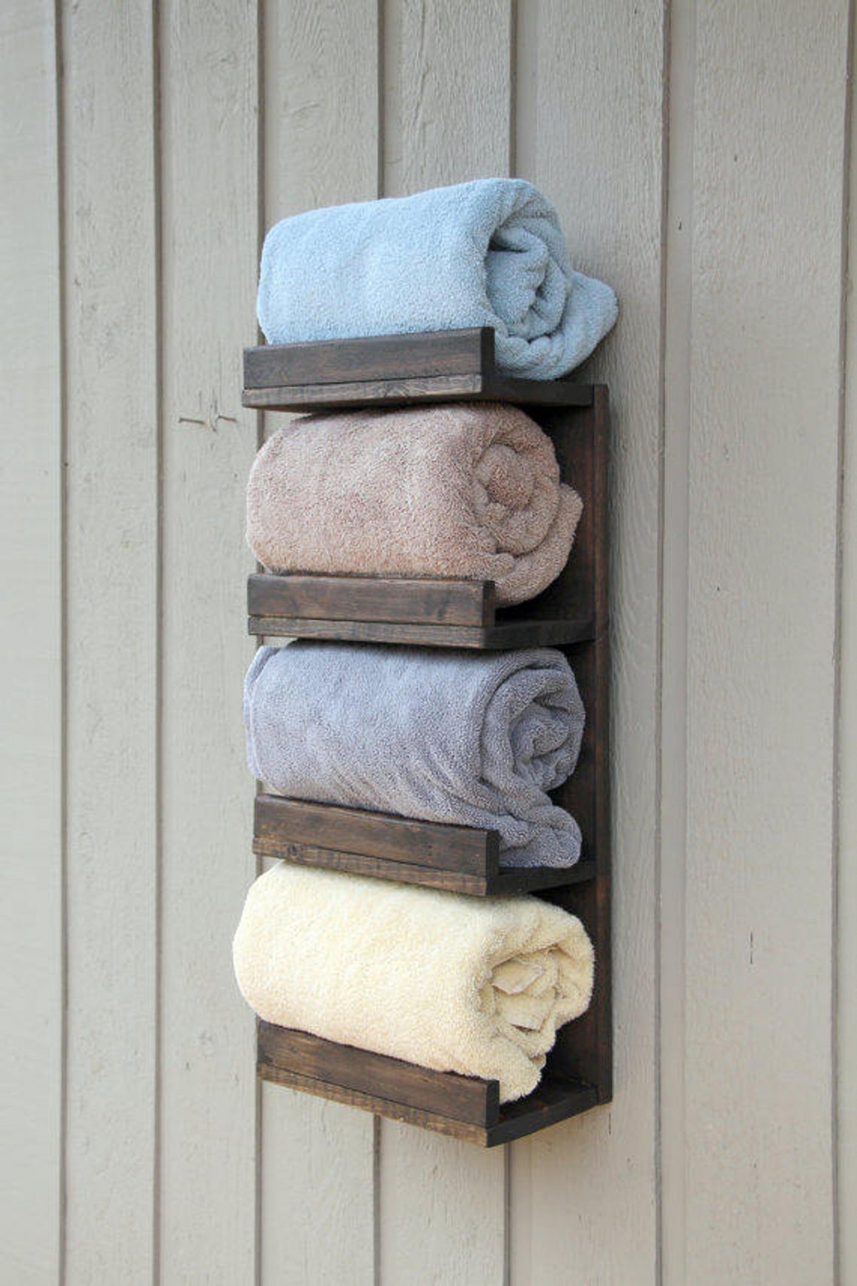 A rustic towel organizer