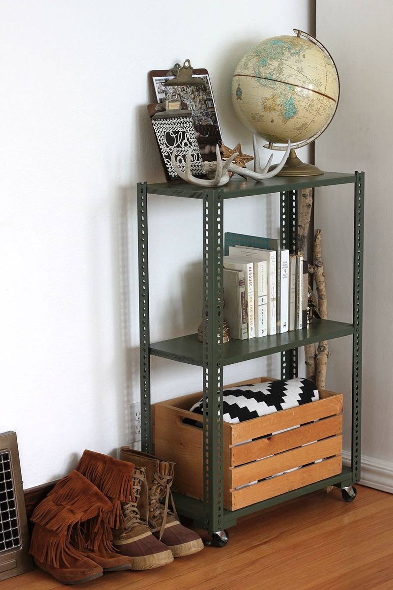 A wheeled shelving unit made with plated slotted angles