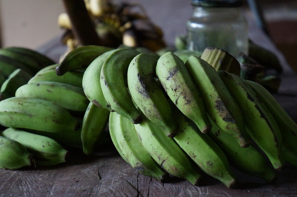 Five Green potatoes and bananas