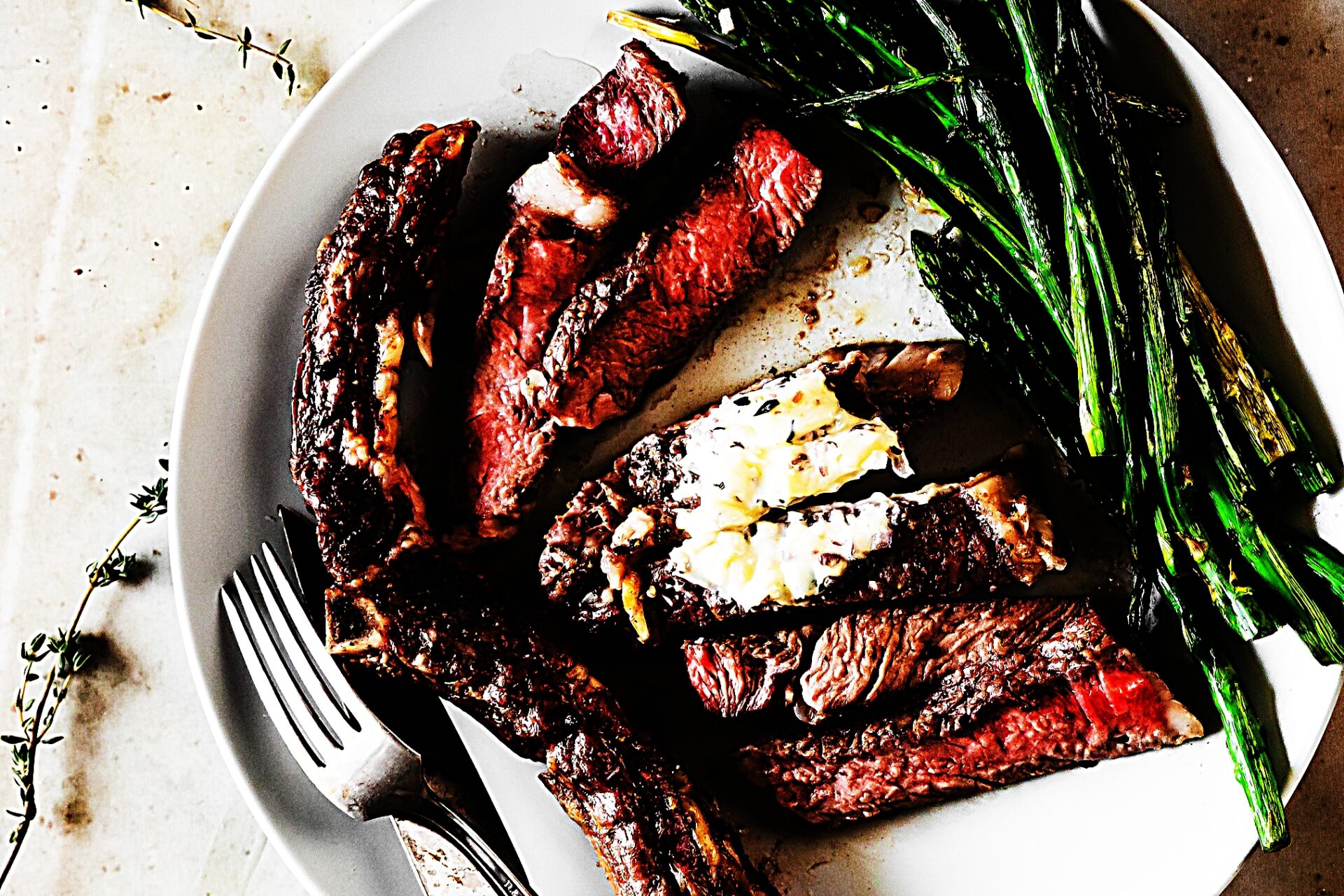 Meal photo - Grilled Black Pepper Ribeye Steaks with Thyme-Shallot Butter