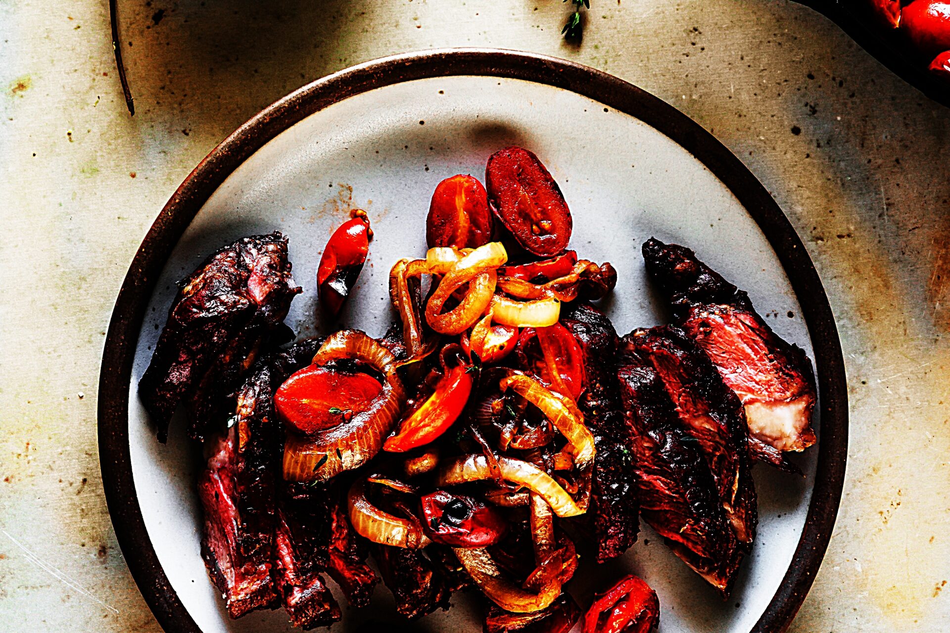 Meal photo - Grilled Garlic and Thyme Strip Steaks with Seared Onions and Tomatoes