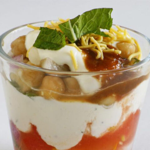 Punjabi-Style Chaat (Layers of Tomatoes, Raita, Ginger Garbanzo beans, Mint Sauce and Tamarind Chutney)