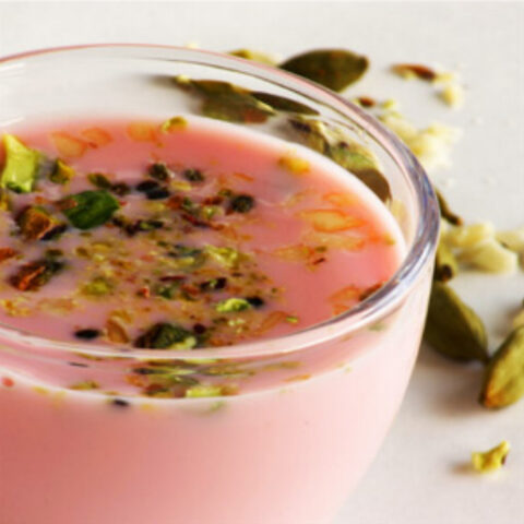 Sharbat (Indian Milk Drink made with Rooh Afza Syrup, Cardamom Seeds, Almonds, Cashews and Pistachios)