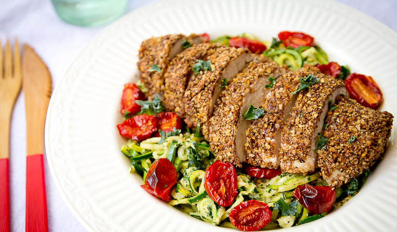 Zucchini Noodles with Kale Pesto, Roasted Tomatoes, and Pecan Crusted Paleo Chicken