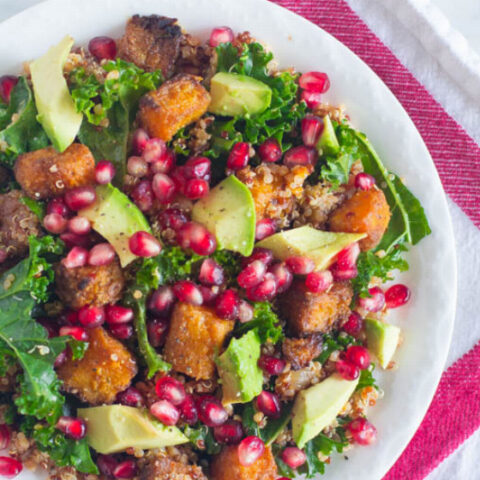 Kale Salad with Butternut Squash, Quinoa, Avocado, Pomegranate and Garlic Sriracha Vinaigrette